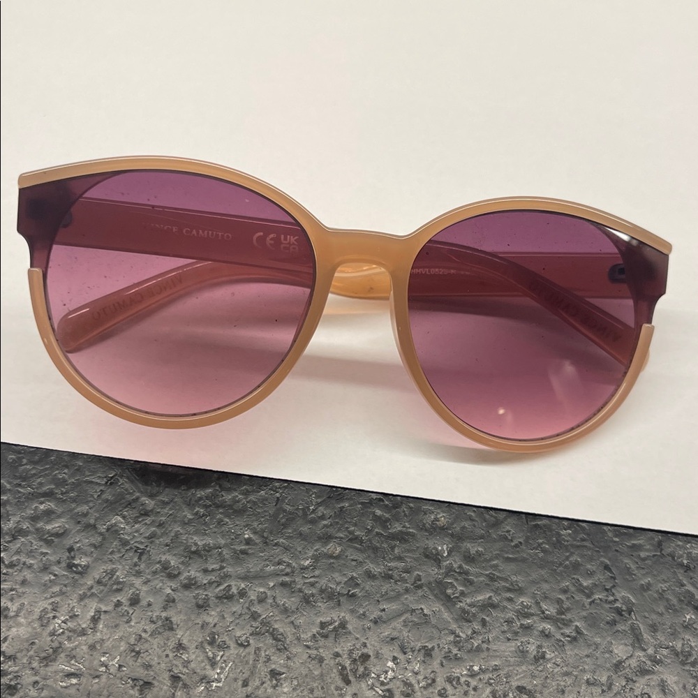 Vince Camuto Tan Sunglasses with brown lenses.